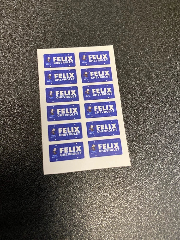 Blue Felix license plate decal sheet with multiple FELIX Chevrolet labels