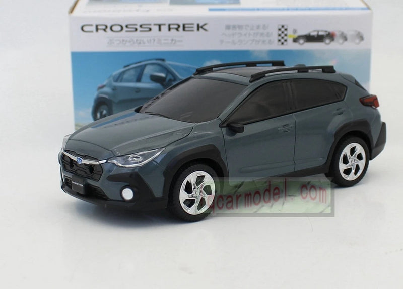 Plastic toy SUV model car in dark gray-green, front three-quarter view
