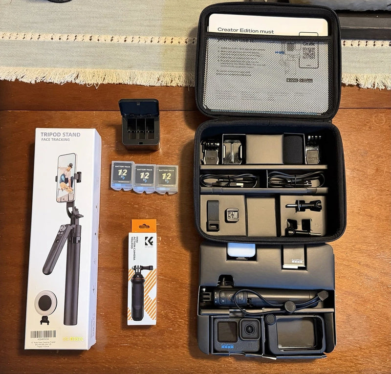 Action camera accessories bundle in open case with mounts, cables, and camera