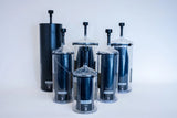 Set of dark and clear cylindrical fiber canisters with vent caps