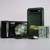 Black Fujifilm digital camera with lens, battery and charging cable kit, viewed front and back