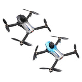 Quadcopter drone with four propellers, gray/black and blue body