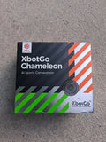 XbotGo Chameleon AI sports cameraman box, orange striped design and lens graphic
