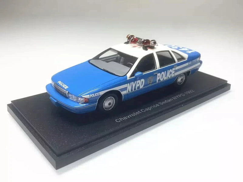 Blue NYPD police model sedan, 1:43 resin Chevrolet Caprice with display base