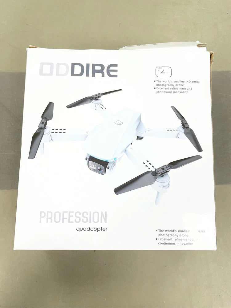 Oddire professional quadcopter drone with four propellers, white and gray, in retail box