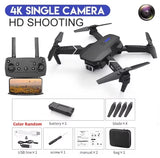 Black quadcopter drone with 4K camera, remote controller, battery and propellers kit