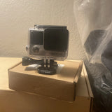 GoPro HERO4 action camera in clear waterproof case with mount base