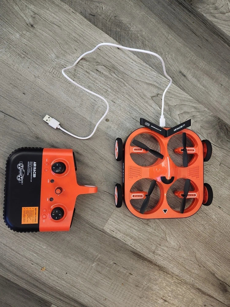Orange/black air racer drone with handheld controller, used open box