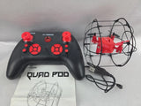 Black nano quadcopter drone with red controller and wireframe prop cage
