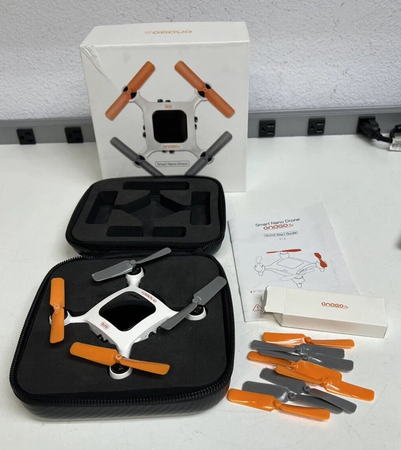 Smart nano drone kit with controller, orange propellers, and carrying case