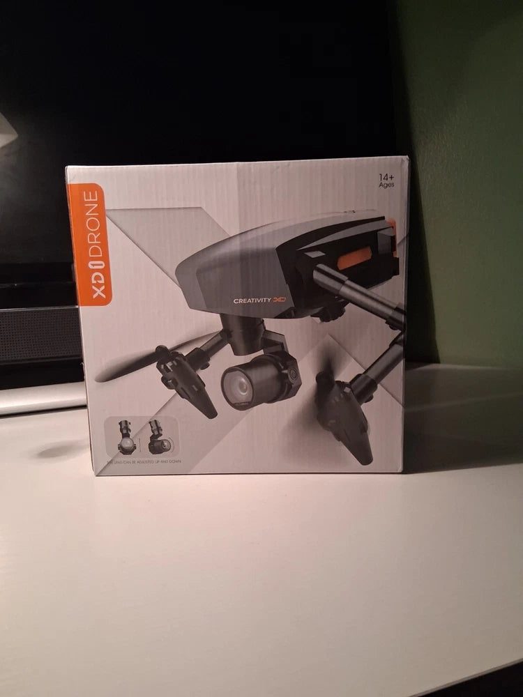Foldable 4K dual-camera drone packaging with drone and camera graphics