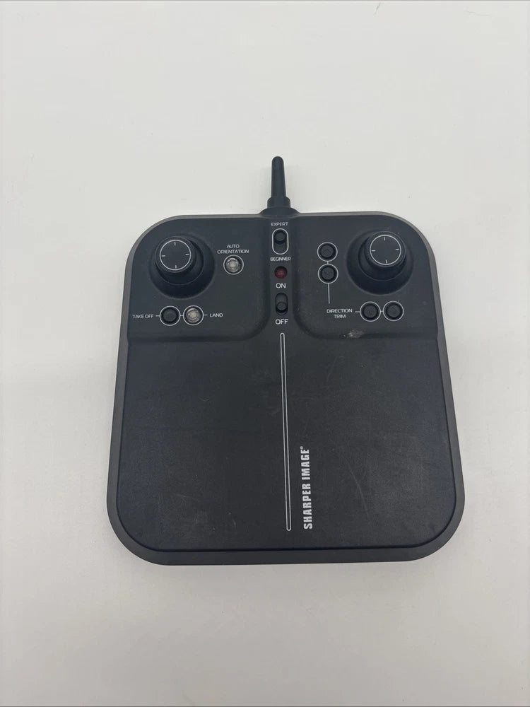 Black handheld drone remote control with two thumbsticks and antenna