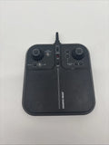Black handheld drone remote control with two thumbsticks and antenna