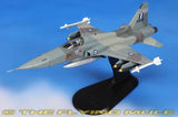 1:72 scale gray F-5A fighter jet model on black display stand with missiles
