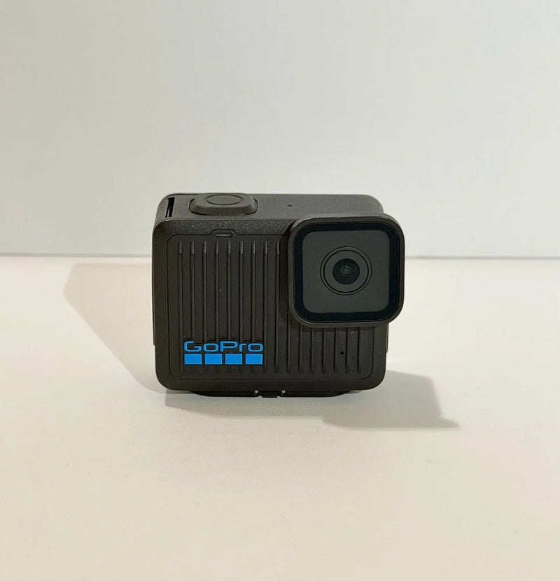 Black GoPro action camera with front lens and blue LED, rugged housing
