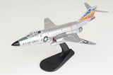 Gray and white F-101C jet model with black display stand