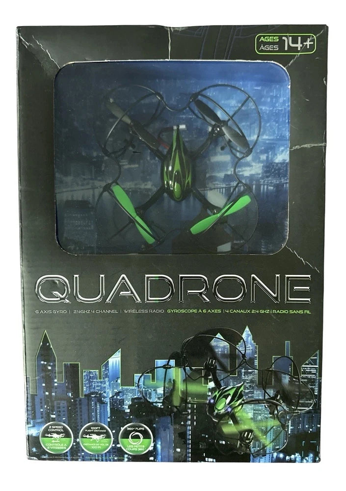 Quadrone quadcopter drone retail box with green 4-blade drone in clear window