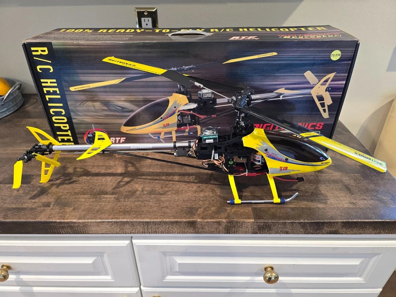 Yellow and blue RC helicopter with black frame, ready-to-fly model