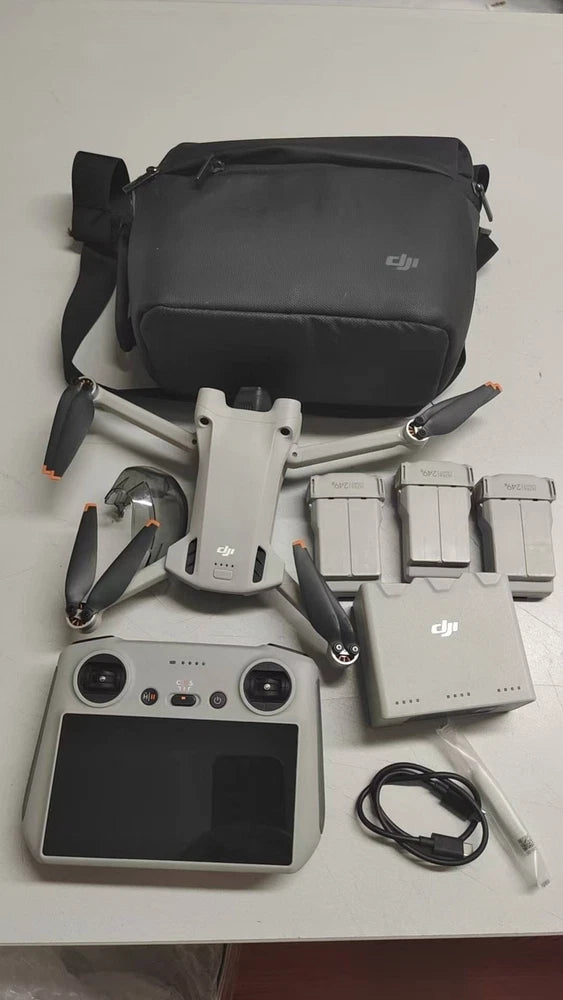 DJI Mini 3 Pro kit with drone, controller, batteries, and carrying bag