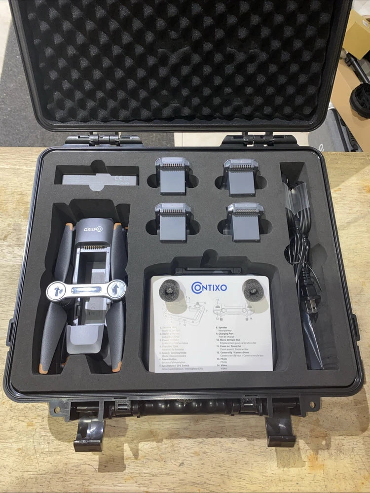 Drone kit in black hard-shell case with drone body, gimbal mount and spare parts