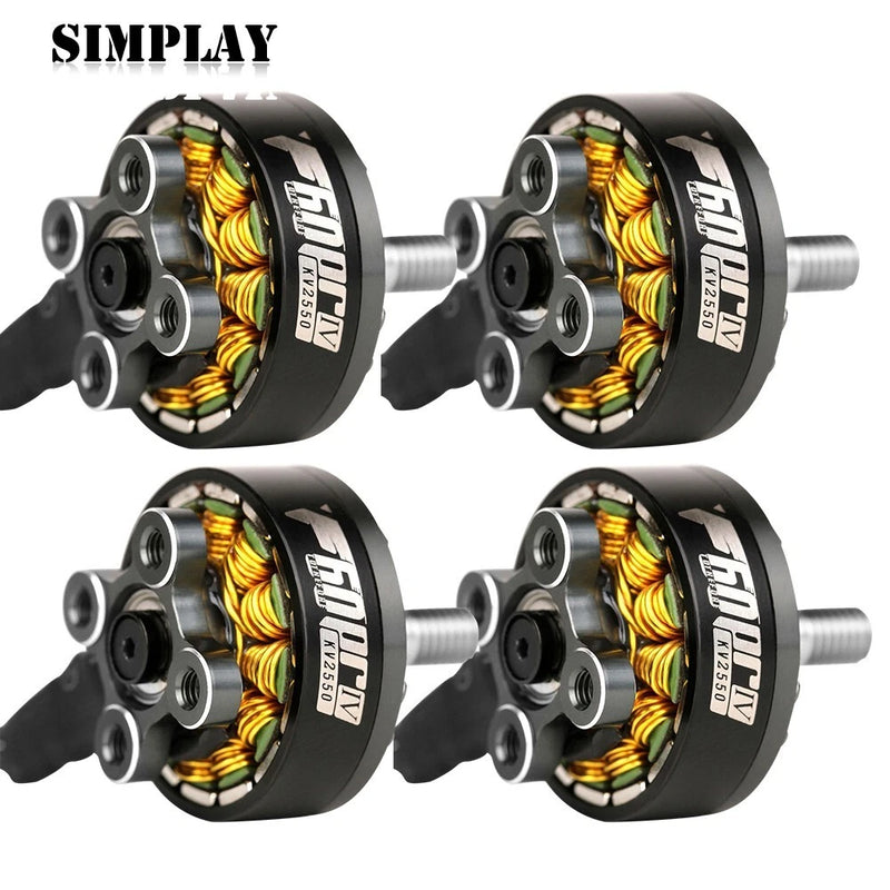 Set of four black brushless FPV drone motors with silver shafts and visible coil windings