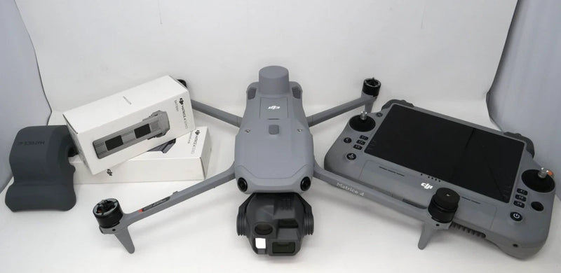 Enterprise drone with remote controller, gray body and folded propellers