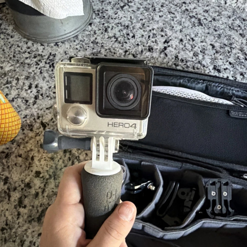 GoPro Hero4 silver action camera in clear waterproof housing with lens and rear screen