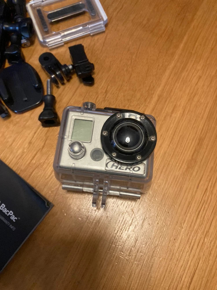 GoPro HERO action camera in clear waterproof case with mounting accessories
