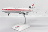 White and red MD-11 model airplane with Martinair markings on display stand