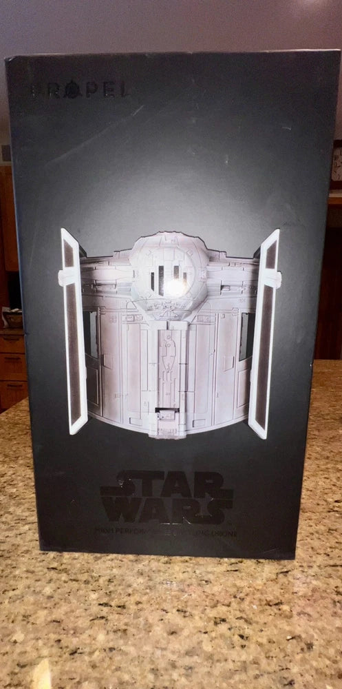 Star Wars Tie Fighter collectors box drone packaging, dark gray with white craft graphic