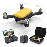 Foldable quadcopter drone with camera, yellow top, controller and carrying case