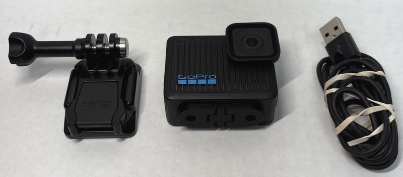 Black GoPro digital action camera with mounting and USB cable