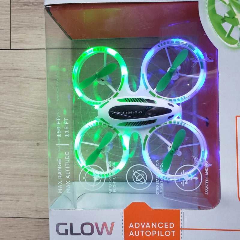 LED glow stunt drone in retail box, white quadcopter with four illuminated wheel rings