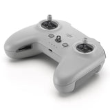 FPV remote controller with dual thumb joysticks and control buttons, light gray