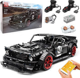 Black RC building block sports car model with red wheels, front three-quarter view