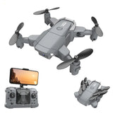 Gray 4K mini quadcopter drone with four propellers and foldable arms, includes display remote