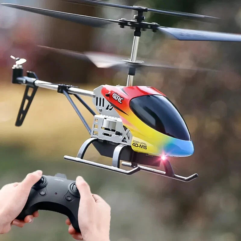 RC helicopter toy with LED, red yellow blue body, handheld controller in use