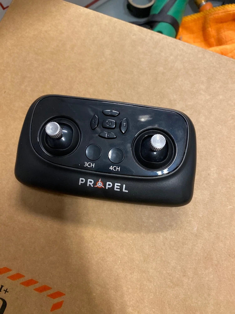 Black Propel remote controller with two joysticks and 3CH/4CH buttons