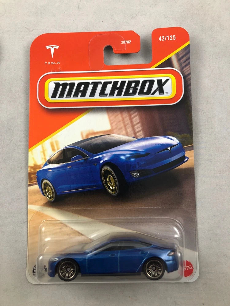 Matchbox die-cast model car in blue package with Tesla Model S 42/125 label