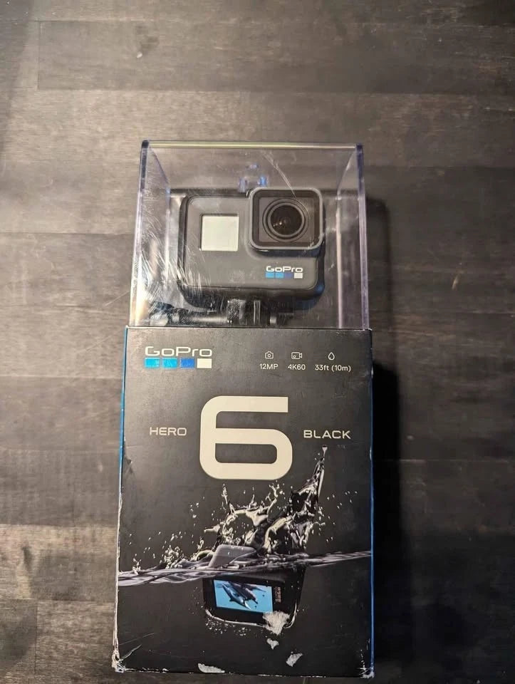 GoPro HERO6 Black action camcorder in retail box, front view with camera lens