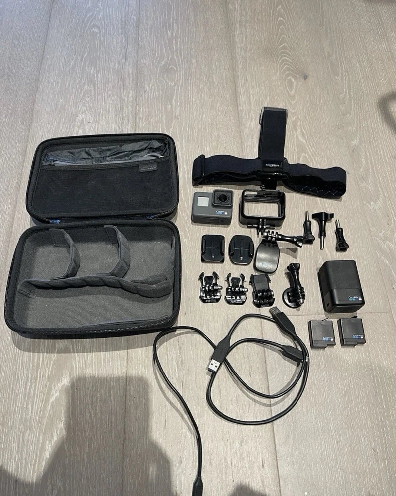 GoPro HERO6 Black waterproof action camera kit with case, mounts, cables, and batteries