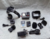 GoPro Hero6 Black action camera with touch screen and multiple mounting accessories