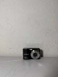Fujifilm compact digital camera, black body with silver lens ring and front controls.