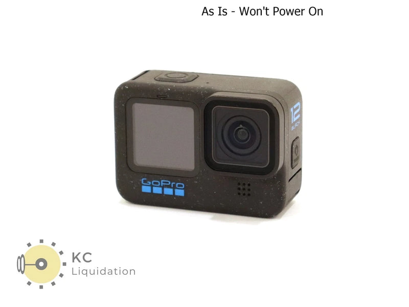 Black action camera with front display and dual-lens housing, as-is for parts