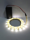 Battery-powered warm white LED strip with circular ring and black battery pack