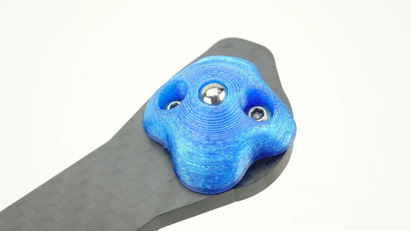 Blue metal landing skid mount bracket with screw holes for FPV drone frame