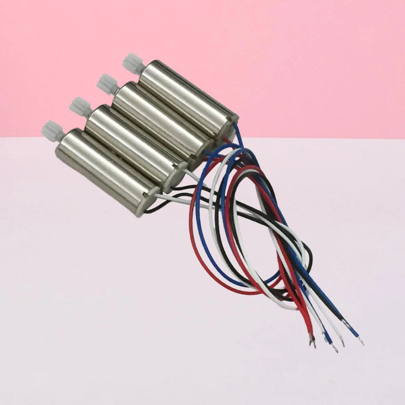 Set of four mini motors with shafts and colored wire leads