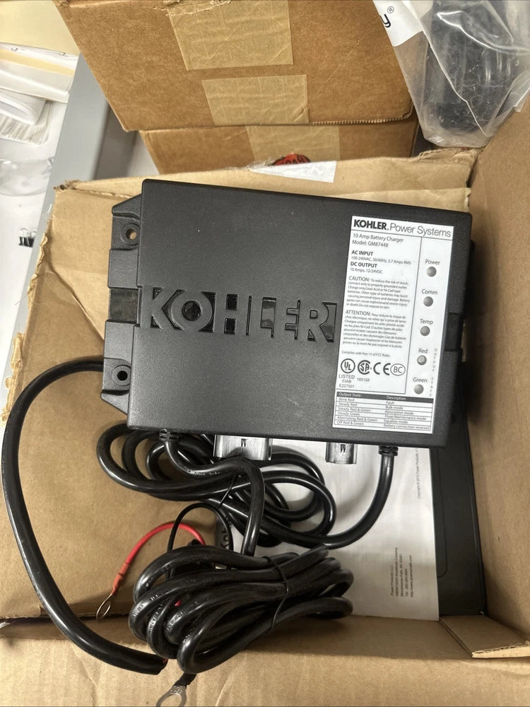 Kohler black battery charger with attached power cable and terminal leads