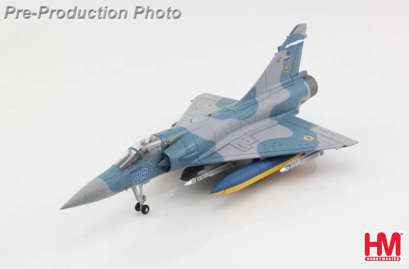 1/72 scale fighter jet model, gray-blue with Ukrainian-style markings, angled view