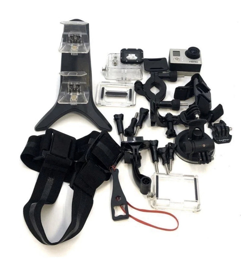 GoPro HERO3 silver action camera with black mounting accessories and chest strap